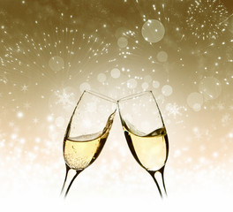 Glasses with champagne against holiday lights