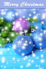 Christmas balls on fir tree, on color background