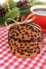 Sweet cookies with cup of tea on table close-up