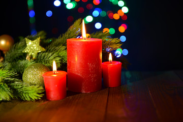 Composition with burning candles, fir tree and Christmas