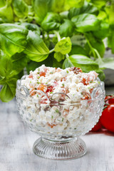 Healthy breakfast: cottage cheese with tomatoes and herbs