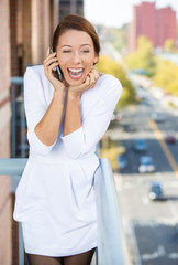 Happy business woman having conversation on a cell phone