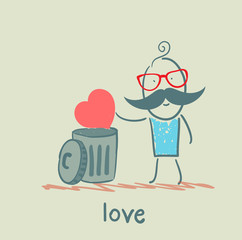 man throws the heart into the bin