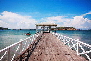 Fototapeta premium White wooden bridge at the Palace near the sea, Thailand