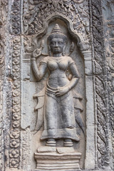 Fototapeta na wymiar Apsaras on the wall of Angkor Wat