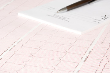 Empty medical prescription on electrocardiogram (ECG) chart