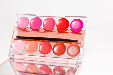 cosmetics on white paper