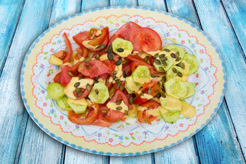 Mediterranean salad with tomato cucumber pumpkin seeds