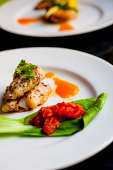 Yellow tail fillet, carrot puree and braised bak choy and tomato