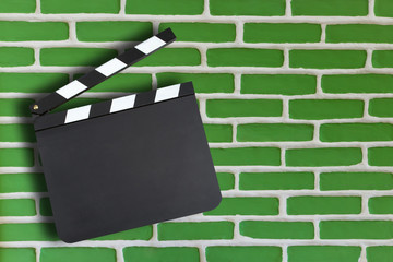 Blank movie production clapper board brick wall background