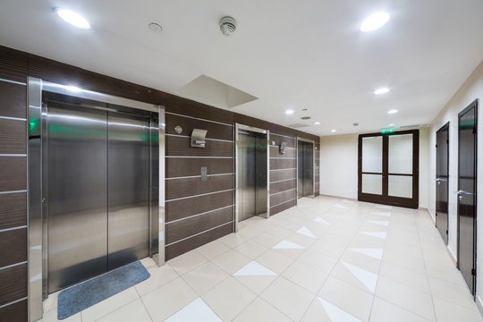 Three chrome elevator in the hallway