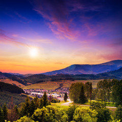 light  beam falls on hillside with autumn forest in mountain on