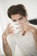 closeup man at breakfast in kitchen