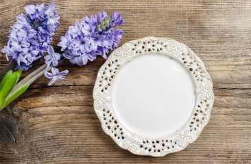 Top view on empty plate on wooden table