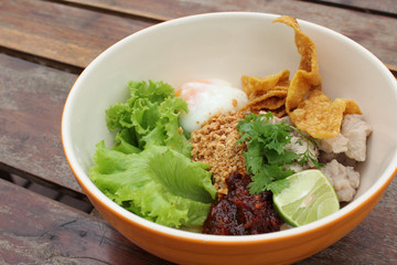 Dry noodles with pork, egg, and lemon