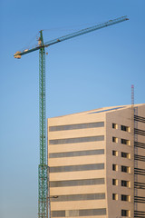 Fototapeta na wymiar Construction site with crane and building