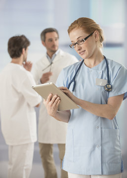 female doctor using digital tablet at hospital
