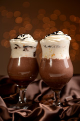 Tasty dessert with chocolate, cream and orange sauce,