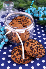 Delicious Christmas cookies in jar on table close-up