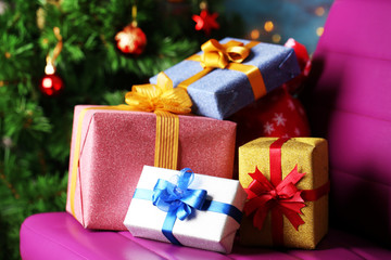 Fototapeta na wymiar Christmas gift boxes on Christmas tree background