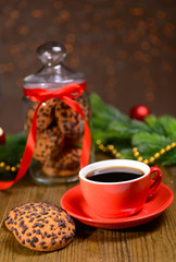 Delicious Christmas cookies in jar on table on brown background