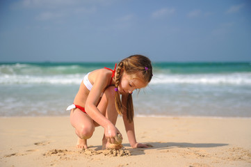 little girl playing with sand