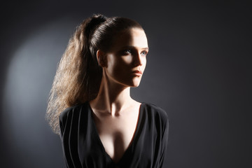 Fototapeta premium Fashion woman studio portrait with ponytail