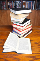 open books on wooden table