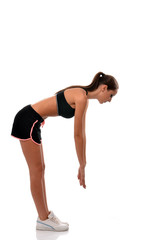 Fitness lady doing workout reaching for her toes