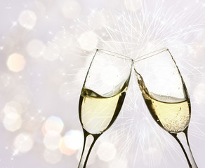Glasses of champagne against holiday lights