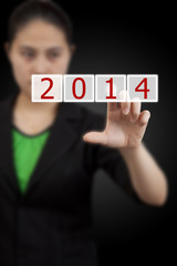 Screen button with 2014 number on hand.