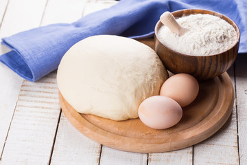 Dough on wooden board