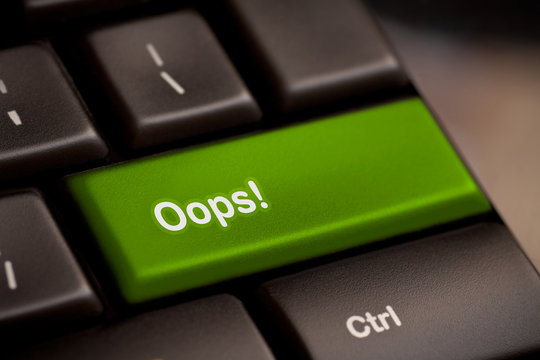 mistake concepts, with oops message on keyboard.