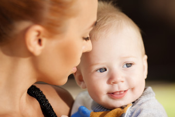 Fashionable modern mother on a urban street with a pram. Young m