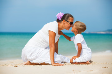 Mother and son having fun on the beach