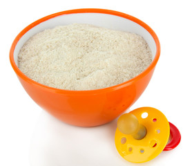Powdered milk in bowl for baby and nipple isolated on white