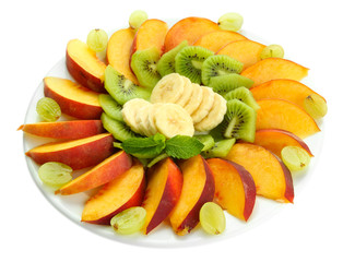 Obraz na płótnie Canvas Assortment of sliced fruits on plate, isolated on white