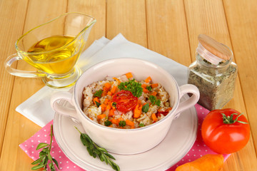 Delicious rice with vegetables and herbs in pot