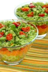 Tasty salad with fresh vegetables, isolated on white