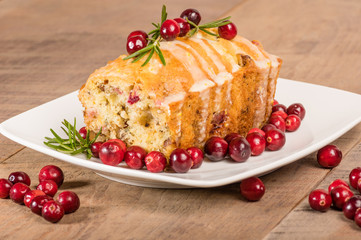Cranberry walnut bread on a white plate