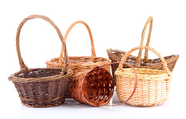 Empty wicker baskets, isolated on white