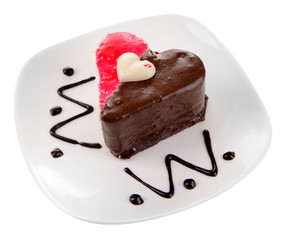 Sweet cake with chocolate on plate isolated on white