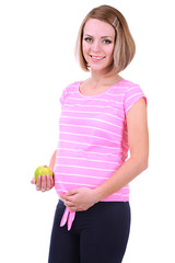 Young pregnant woman holding green apple isolated on white