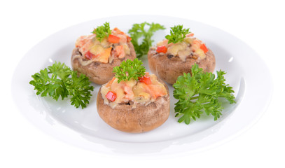 Stuffed mushrooms on plate isolated on white