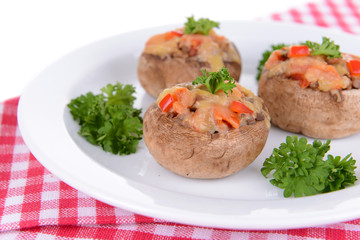 Stuffed mushrooms on plate on table close-up