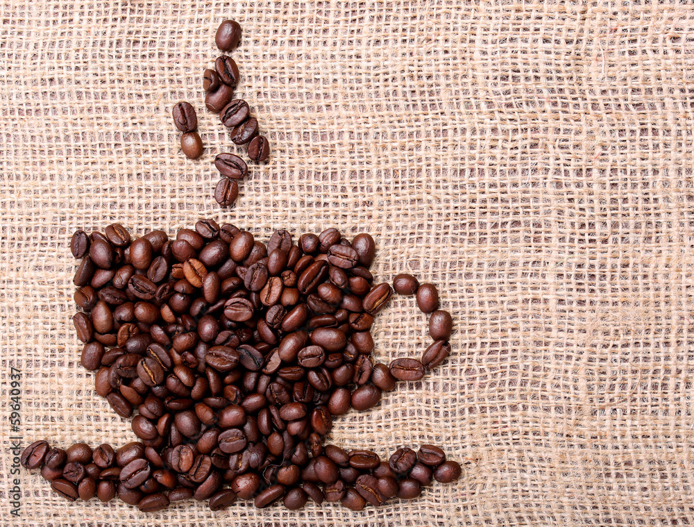 Wall mural Coffee Beans, placed in shape of cup on burlap