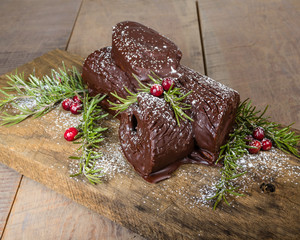 Chocolate Yule log with cranberries