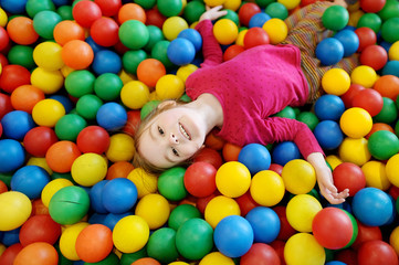 Fototapeta na wymiar Little girl having fun at the playground