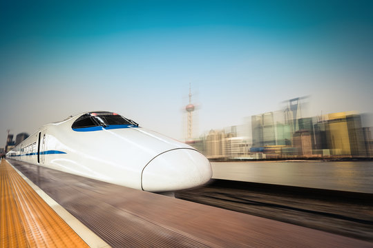 Fototapeta high speed train and modern urban background