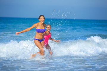 Girls running beach